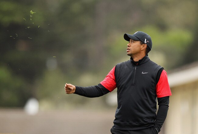 PEBBLE BEACH, CA - FEBRUARY 12:  Tiger Woods checks the wind before hitting his his tee shot on the first hole during the final round of the AT&T Pebble Beach National Pro-Am at Pebble Beach Golf Links on February 12, 2012 in Pebble Beach, California.  (Photo by Ezra Shaw/Getty Images)