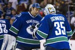 VANCOUVER, CANADA - NOVEMBER 29: Goalie Roberto Luongo #1 of the Vancouver Canucks congratulates goalie Cory Schneider #35 after defeating the Columbus Blue Jackets in NHL action on November 29, 2011 at Rogers Arena in Vancouver, British Columbia, Canada.  (Photo by Rich Lam/Getty Images)