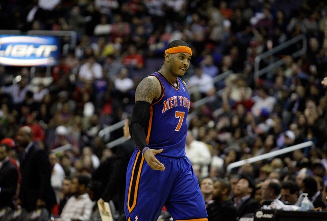 WASHINGTON, DC - JANUARY 06:  Carmelo Anthony #7 of the New York Knicks reacts after making a basket during the second half against the Washington Wizards at Verizon Center on January 6, 2012 in Washington, DC.  NOTE TO USER: User expressly acknowledges and agrees that, by downloading and or using this photograph, User is consenting to the terms and conditions of the Getty Images License Agreement.  (Photo by Rob Carr/Getty Images)