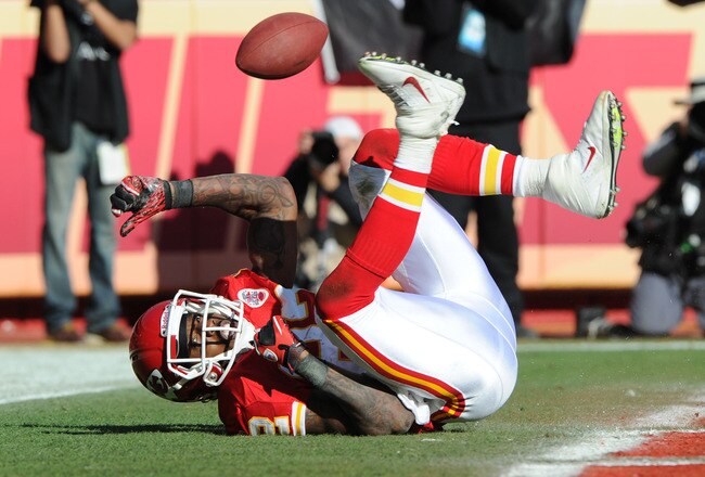 KANSAS CITY, MO - DECEMBER 24:  Wide receiver Dwayne Bowe #82 of the Kansas City Chiefs drops a potential touchdown against the Oakland Raiders during the first half on December 24, 2011 at Arrowhead Stadium in Kansas City, Missouri.  (Photo by Peter Aiken/Getty Images)