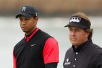 PEBBLE BEACH, CA - FEBRUARY 12:  (L-R) Tiger Woods and Phil Mickelson wait on the tee box on the seventh hole during the final round of the AT&T Pebble Beach National Pro-Am at Pebble Beach Golf Links on February 12, 2012 in Pebble Beach, California.  (Photo by Ezra Shaw/Getty Images)