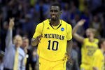 CHARLOTTE, NC - MARCH 20:  Tim Hardaway Jr. #10 of the Michigan Wolverines reacts after making a three-pointer in the second half while taking on the Duke Blue Devils during the third round of the 2011 NCAA men's basketball tournament at Time Warner Cable Arena on March 20, 2011 in Charlotte, North Carolina.  (Photo by Streeter Lecka/Getty Images)