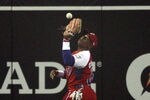 SAN DIEGO - MARCH 18:  Yoennis Cespedes #51 of Cuba drops a fly ball to allow two runs to Japan during the 2009 World Baseball Classic Round 2 Pool 1 Game 5 on March 18, 2009 at Petco Park in San Diego, California.  (Photo by Donald Miralle/Getty Images)