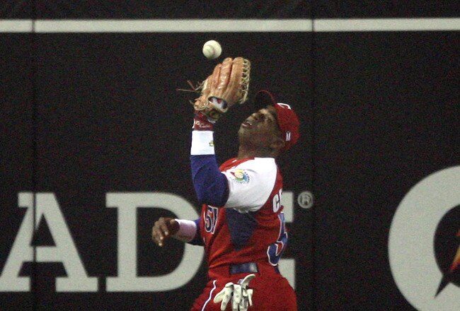 SAN DIEGO - MARCH 18:  Yoennis Cespedes #51 of Cuba drops a fly ball to allow two runs to Japan during the 2009 World Baseball Classic Round 2 Pool 1 Game 5 on March 18, 2009 at Petco Park in San Diego, California.  (Photo by Donald Miralle/Getty Images)