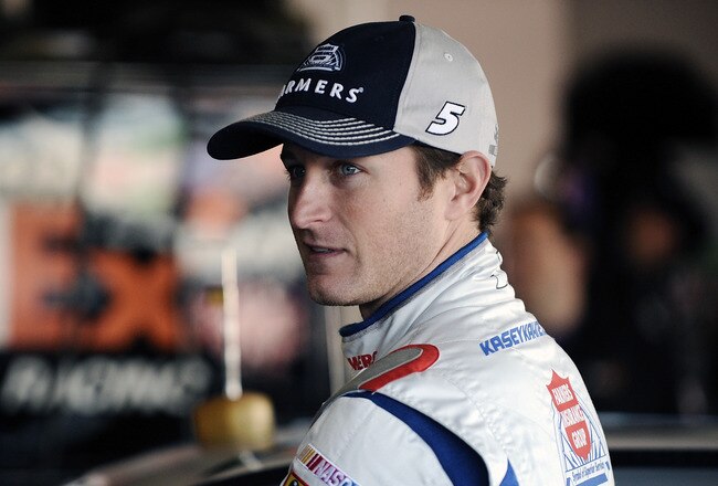 DAYTONA BEACH, FL - JANUARY 14:  Kasey Kahne, driver of the #5 Farmer's Insurance Group, stands in the garage area during Daytona Preseason Thunder at Daytona International Speedway on January 14, 2012 in Daytona Beach, Florida.  (Photo by Jared C. Tilton/Getty Images for NASCAR)