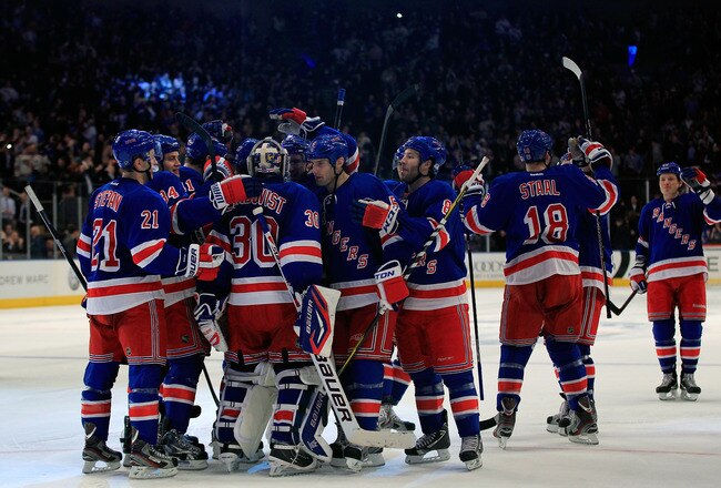 NEW YORK, NY - JANUARY 10: Henrik Lundqvist #30 of the New York Rangers is congratulated for his game winning save against Shane Doan #19 of the Phoenix Coyotes in a penalty shoot out at Madison Square Garden on January 10, 2012 in New York City.  (Photo by Chris Trotman/Getty Images)