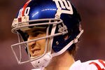 INDIANAPOLIS, IN - FEBRUARY 05:  Eli Manning #10 of the New York Giants looks on against the New England Patriots during Super Bowl XLVI at Lucas Oil Stadium on February 5, 2012 in Indianapolis, Indiana.  (Photo by Jamie Squire/Getty Images)