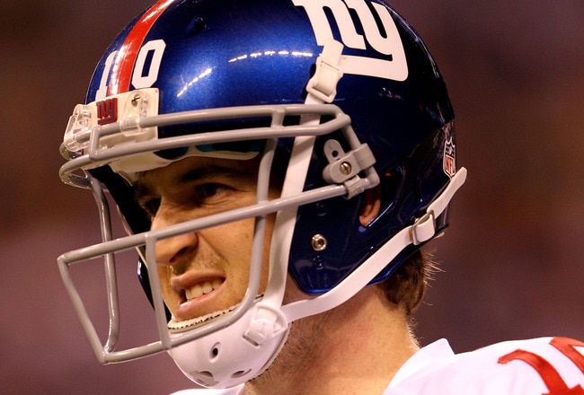 INDIANAPOLIS, IN - FEBRUARY 05:  Eli Manning #10 of the New York Giants looks on against the New England Patriots during Super Bowl XLVI at Lucas Oil Stadium on February 5, 2012 in Indianapolis, Indiana.  (Photo by Jamie Squire/Getty Images)