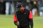 PEBBLE BEACH, CA - FEBRUARY 12:  Tiger Woods reacts after hitting his second shot on the 15th hole during the final round of the AT&T Pebble Beach National Pro-Am at Pebble Beach Golf Links on February 12, 2012 in Pebble Beach, California.  (Photo by Ezra Shaw/Getty Images)