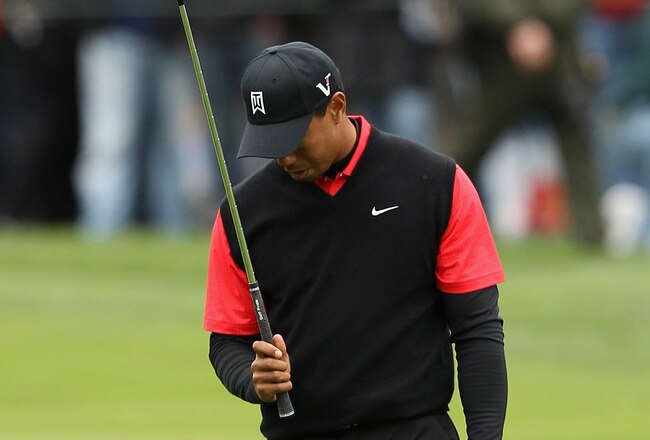PEBBLE BEACH, CA - FEBRUARY 12:  Tiger Woods reacts after hitting his second shot on the 15th hole during the final round of the AT&T Pebble Beach National Pro-Am at Pebble Beach Golf Links on February 12, 2012 in Pebble Beach, California.  (Photo by Ezra Shaw/Getty Images)