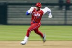 SAN DIEGO - MARCH 18: Yoennis Cespedes #51 of Cuba runs to third base after hitting into the corner of the outfield againts Japan during the 2009 World Baseball Classic Round 2 Pool 1 Game 5 on March 18, 2009 at Petco Park in San Diego, California.  (Photo by Jeff Bottari/Getty Images)