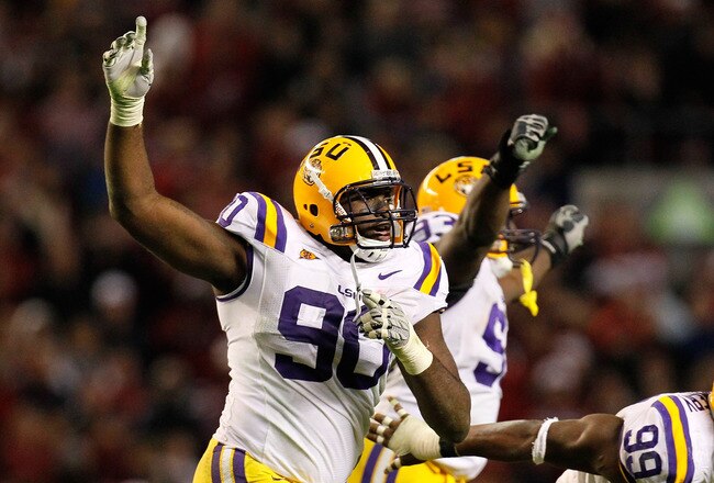 TUSCALOOSA, AL - NOVEMBER 05:  Michael Brockers #90 and Sam Montgomery #99 of the LSU Tigers react after the Alabama Crimson Tide missed their field goal in overtime at Bryant-Denny Stadium on November 5, 2011 in Tuscaloosa, Alabama.  (Photo by Kevin C. Cox/Getty Images)