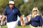 MELBOURNE, AUSTRALIA - NOVEMBER 17: Phil Mickelson of the U.S. Team (L) walks with wife Amy Mickelson (R) during the Day One Foursome Matches of the 2011 Presidents Cup at Royal Melbourne Golf Course on November 17, 2011 in Melbourne, Australia.  (Photo by David Cannon/Getty Images)