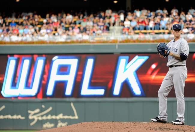 MINNEAPOLIS, MN - AUGUST 20: A.J. Burnett #34 of the New York Yankees reacts to walking Joe Mauer #7 of the Minnesota Twins to fill the bases in the second inning on August 20, 2011 at Target Field in Minneapolis, Minnesota. (Photo by Hannah Foslien/Getty Images)