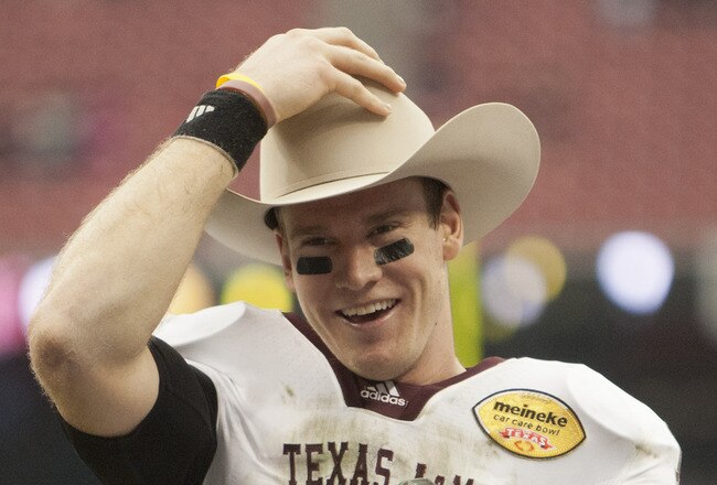 HOUSTON - DECEMBER 31:  Quarterback Ryan Tannehill #17 of Texas A&M Texas A&M Aggies holds his MVP trophy after Texas A&M defeated Northwesten University 33-22 at Reliant Stadium on December 31, 2011 in Houston, Texas.  (Photo by Bob Levey/Getty Images)