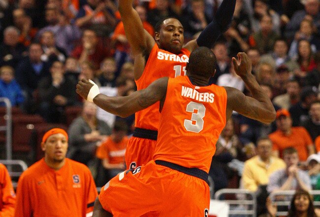PHILADELPHIA, PA - JANUARY 11:  Scoop Jardine #11 and Dion Waiters #3 of the Syracuse Orange celebrate a play against the Villanova Wildcats at the Wells Fargo Center on January 11, 2012 in Philadelphia, Pennsylvania.  (Photo by Chris Chambers/Getty Images)