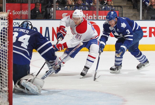 TORONTO, CANADA - FEBRUARY 11:  Lars Eller #81 of the Montreal Canadiens gets set to cut in front of James Reimer #34 of the Toronto Maple Leafs and score in a game on February 11, 2012 at the Air Canada Centre in Toronto, Canada. The Canadiens defeated the Leafs 5-0. (Photo by Claus Andersen/Getty Images)