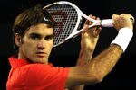 MELBOURNE, AUSTRALIA - JANUARY 26:  Roger Federer of Switzerland plays a backhand in his semifinal match against Rafael Nadal of Spain during day eleven of the 2012 Australian Open at Melbourne Park on January 26, 2012 in Melbourne, Australia.  (Photo by Quinn Rooney/Getty Images)
