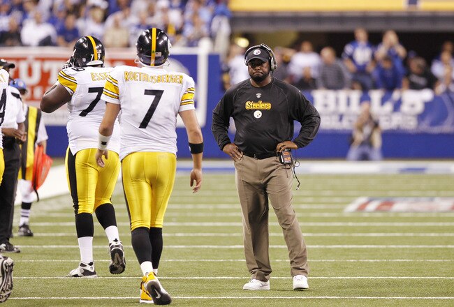 INDIANAPOLIS, IN - SEPTEMBER 25: Ben Roethlisberger #7 of the Pittsburgh Steelers walks off the field in front of head coach Mike Tomlin after throwing an interception against the Indianapolis Colts at Lucas Oil Stadium on September 25, 2011 in Indianapolis, Indiana. The Steelers won 23-20. (Photo by Joe Robbins/Getty Images)