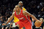 LOS ANGELES, CA - DECEMBER 19:  Randy Foye #4 of the Los Angeles Clippers dribbles around Kobe Bryant #24 of the Los Angeles Lakers during a 114-95 Clipper win at Staples Center on December 19, 2011 in Los Angeles, California.  (Photo by Harry How/Getty Images)