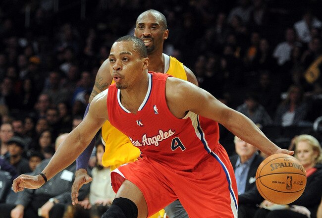 LOS ANGELES, CA - DECEMBER 19:  Randy Foye #4 of the Los Angeles Clippers dribbles around Kobe Bryant #24 of the Los Angeles Lakers during a 114-95 Clipper win at Staples Center on December 19, 2011 in Los Angeles, California.  (Photo by Harry How/Getty Images)