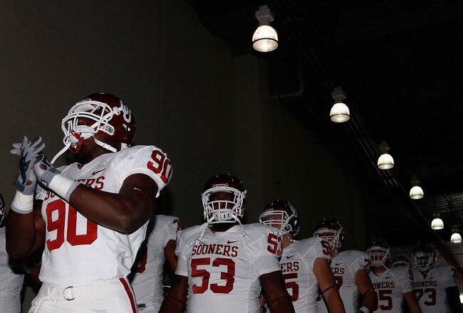 DALLAS - OCTOBER 17:  David King #90 of the Oklahoma Sooners leads the team out of the tunnel before a game with the Texas Longhorns at Cotton Bowl on October 17, 2009 in Dallas, Texas.  (Photo by Ronald Martinez/Getty Images)