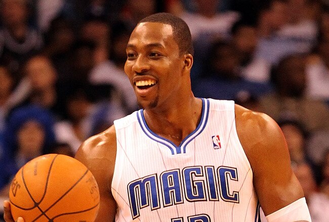 ORLANDO, FL - FEBRUARY 06:  Dwight Howard #12 of the Orlando Magic smiles during the game against the Los Angeles Clippers at Amway Center on February 6, 2012 in Orlando, Florida.   NOTE TO USER: User expressly acknowledges and agrees that, by downloading and or using this Photograph, user is consenting to the terms and conditions of the Getty Images License Agreement.  (Photo by Sam Greenwood/Getty Images)