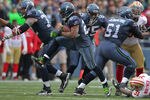 SEATTLE - DECEMBER 24:  Running back Marshawn Lynch #24 of the Seattle Seahawks rushes against the San Francisco 49ers at CenturyLink Field on December 24, 2011 in Seattle, Washington. (Photo by Otto Greule Jr/Getty Images)