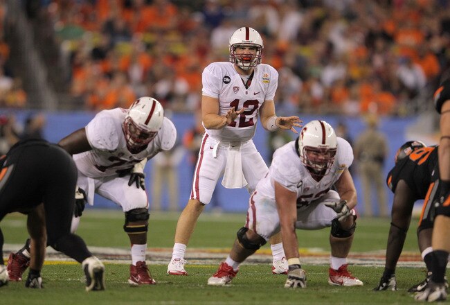 GLENDALE, AZ - JANUARY 02:  Andrew Luck #12 of the Stanford Cardinal calls signals out of the shotgun formation against the Oklahoma State Cowboys during the Tostitos Fiesta Bowl on January 2, 2012 at University of Phoenix Stadium in Glendale, Arizona. Oklahoma State won 41-38 in overtime. (Photo by Doug Pensinger/Getty Images)