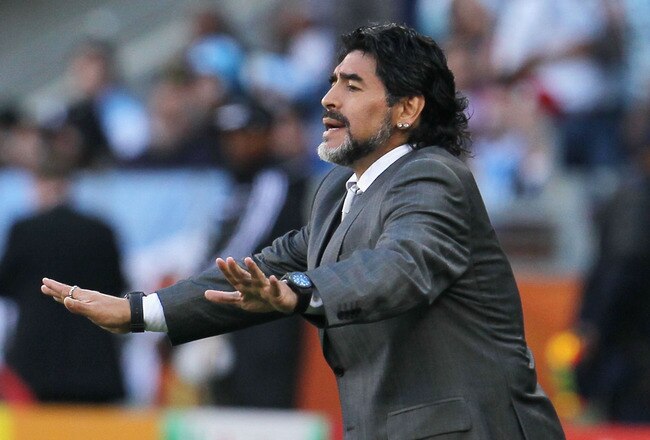 CAPE TOWN, SOUTH AFRICA - JULY 03: Diego Maradona head coach of Argentina gestures from the touchline during the 2010 FIFA World Cup South Africa Quarter Final match between Argentina and Germany at Green Point Stadium on July 3, 2010 in Cape Town, South Africa.  (Photo by Chris McGrath/Getty Images)