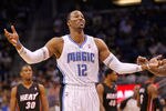 ORLANDO, FL - DECEMBER 21: Dwight Howard #12 of the Orlando Magic argues a call during a preseason game against the Miami Heat at Amway Center on December 21, 2011 in Orlando, Florida. NOTE TO USER: User expressly acknowledges and agrees that, by downloading and/or using this Photograph, User is consenting to the terms and conditions of the Getty Images License Agreement.  (Photo by Mike Ehrmann/Getty Images)