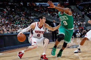 ATLANTA, GA - APRIL 01:  Kirk Hinrich #6 of the Atlanta Hawks against Rajon Rondo #9 of the Boston Celtics at Philips Arena on April 1, 2011 in Atlanta, Georgia.  NOTE TO USER: User expressly acknowledges and agrees that, by downloading and/or using this Photograph, user is consenting to the terms and conditions of the Getty Images License Agreement.  (Photo by Kevin C. Cox/Getty Images)