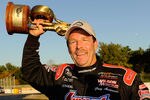 CONCORD, NC - SEPTEMBER 19:  Pro Stock winner Greg Anderson celebrates with his Wally during the O'Reilly Auto Parts NHRA Nationals at zMax Dragway on September 19, 2010 in Concord, North Carolina.  (Photo by Rusty Jarrett/Getty Images)