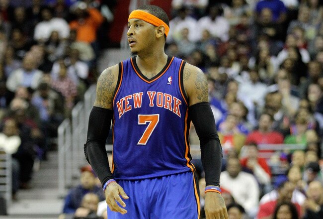 WASHINGTON, DC - JANUARY 06:  Carmelo Anthony #7 of the New York Knicks reacts after making a basket during the second half against the Washington Wizards at Verizon Center on January 6, 2012 in Washington, DC.  NOTE TO USER: User expressly acknowledges and agrees that, by downloading and or using this photograph, User is consenting to the terms and conditions of the Getty Images License Agreement.  (Photo by Rob Carr/Getty Images)