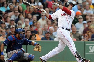 BOSTON, MA - SEPTEMBER 03: Adrian Gonzalez #28 of the Boston Red Sox swings at a pitch as catcher Yorvid Torrealba #8 of the Texas Rangers looks on in the third inning at Fenway Park on September 3, 2011 in Boston, Massachusetts. The Boston Red Sox won the game 12-7. (Photo by Darren McCollester/Getty Images)