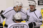 DALLAS, TX - FEBRUARY 12:  Andrei Loktionov #48 of the Los Angeles Kings celebrates a goal with Jack Johnson #3 and Anze Kopitar #11 during play against the Dallas Stars at American Airlines Center on February 12, 2012 in Dallas, Texas.  (Photo by Ronald Martinez/Getty Images)