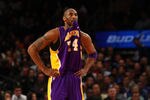 NEW YORK, NY - FEBRUARY 10:  Kobe Brya\nt #24 of the Los Angeles Lakers bites his jersey as he looks on against the New York Knicks in the second quarter at Madison Square Garden on February 10, 2012 in New York City.  NOTE TO USER: User expressly acknowledges and agrees that, by downloading and or using this photograph, User is consenting to the terms and conditions of the Getty Images License Agreement.  (Photo by Chris Chambers/Getty Images)