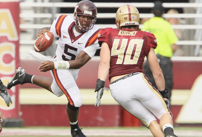 CHESTNUT HILL, MA - SEPTEMBER 25:  Tyrod Taylor #5 of the Virginia Tech Hokies scrambles with the ball as Luke Kuechly #40 of the Boston College Eagles defends on September 25, 2010 at Alumni Stadium in Chestnut Hill, Massachusetts.  (Photo by Elsa/Getty Images)