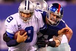 EAST RUTHERFORD, NJ - JANUARY 01:   Dave Tollefson #71 of the New York Giants tries to tackle  Tony Romo #9 of the Dallas Cowboys at MetLife Stadium on January 1, 2012 in East Rutherford, New Jersey.  (Photo by Al Bello/Getty Images)