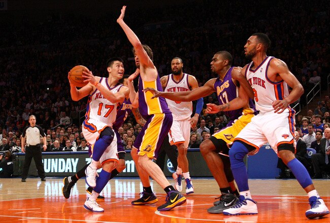 NEW YORK, NY - FEBRUARY 10:  Jeremy Lin #17 of the New York Knicks drives against Pau Gasol #16 of the Los Angeles Lakers in the fourth quarter at Madison Square Garden on February 10, 2012 in New York City.  NOTE TO USER: User expressly acknowledges and agrees that, by downloading and or using this photograph, User is consenting to the terms and conditions of the Getty Images License Agreement.  (Photo by Chris Chambers/Getty Images)