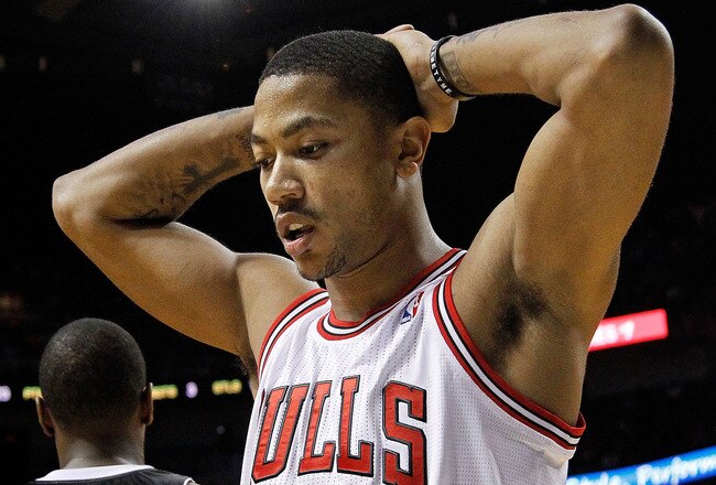 MIAMI, FL - JANUARY 29:  Derrick Rose #1 of the Chicago Bulls looks on during a game against the Miami Heat at American Airlines Arena on January 29, 2012 in Miami, Florida. NOTE TO USER: User expressly acknowledges and agrees that, by downloading and/or using this Photograph, User is consenting to the terms and conditions of the Getty Images License Agreement.  (Photo by Mike Ehrmann/Getty Images)