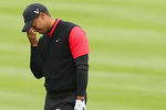 PEBBLE BEACH, CA - FEBRUARY 12:  Tiger Woods reacts after hitting his second shot on the 14th hole during the final round of the AT&T Pebble Beach National Pro-Am at Pebble Beach Golf Links on February 12, 2012 in Pebble Beach, California.  (Photo by Ezra Shaw/Getty Images)