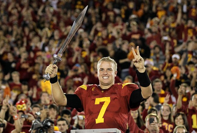 LOS ANGELES, CA - NOVEMBER 26:  Quarterback Matt Barkley #7 of the USC Trojans conducts the band after the game with the UCLA Bruins at the Los Angeles Memorial Coliseum on November 26, 2011 in Los Angeles, California. USC won 50-0.  (Photo by Stephen Dunn/Getty Images)