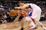 LOS ANGELES, CA - JANUARY 04:   Blake Griffin #32 of the Los Angeles Clippers steals a pass intended for Chandler Parsons #25 of the Houston Rockets at Staples Center on January 4, 2012 in Los Angeles, California.  NOTE TO USER: User expressly acknowledges and agrees that, by downloading and or using this photograph, User is consenting to the terms and conditions of the Getty Images License Agreement.  (Photo by Stephen Dunn/Getty Images)