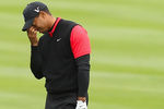 PEBBLE BEACH, CA - FEBRUARY 12:  Tiger Woods reacts after hitting his second shot on the 14th hole during the final round of the AT&T Pebble Beach National Pro-Am at Pebble Beach Golf Links on February 12, 2012 in Pebble Beach, California.  (Photo by Ezra Shaw/Getty Images)