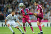 MADRID, SPAIN - OCTOBER 18: Miralem Pjanic (R) of Olympique Lyonnais controls the ball besides Xabi Alonso (L) of Real Madrid and Gueida Fofana of Olympique Lyonnais during the UEFA Champions League group D match between Real Madrid and Olympique Lyonnais at the Estadio Santiago Bernabeu on October 18, 2011 in Madrid, Spain.  (Photo by Jasper Juinen/Getty Images)