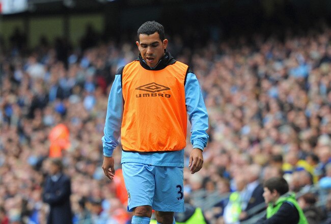MANCHESTER, ENGLAND - SEPTEMBER 24:  Carlos Tevez of Manchester City looks on from the sidelines during the Barclays Premier League match between Manchester City and Everton at the Etihad Stadium on September 24, 2011 in Manchester, England.  (Photo by Michael Regan/Getty Images)