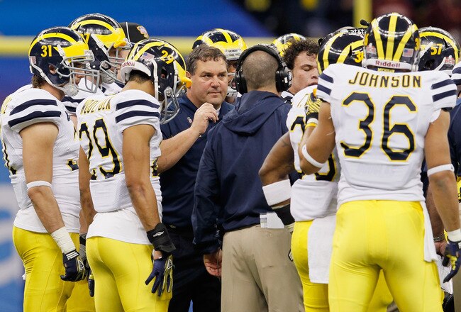 NEW ORLEANS, LA - JANUARY 03:  Head coach Brady Hoke of the Michigan Wolverines talks with his players against the Virginia Tech Hokies during the Allstate Sugar Bowl at Mercedes-Benz Superdome on January 3, 2012 in New Orleans, Louisiana.  (Photo by Kevin C. Cox/Getty Images)