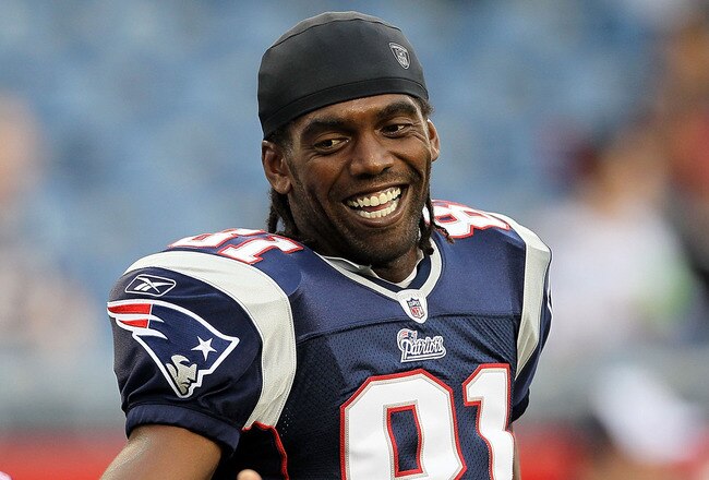 FOXBORO, MA - AUGUST 12: Randy Moss #81 of the New England Patriots smiles before the preseason game against the New Orleans Saints at Gillette Stadium on August 12, 2010 in Foxboro, Massachusetts. (Photo by Jim Rogash/Getty Images)