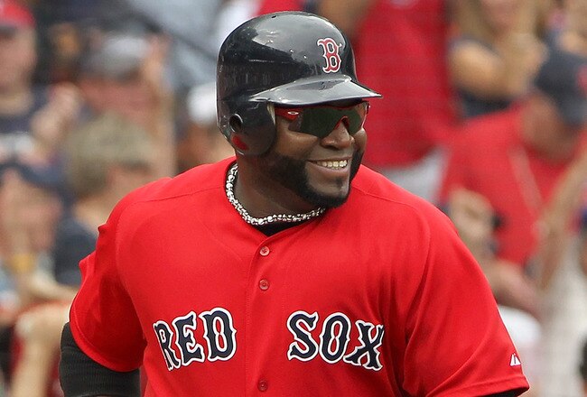 BOSTON, MA - AUGUST 27:  David Ortiz #34 of the Boston Red Sox smiles after scoring on a sacrifice fly against the Oakland Athletics in the third inning  at Fenway Park August 27, 2011 in Boston, Massachusetts. (Photo by Jim Rogash/Getty Images)